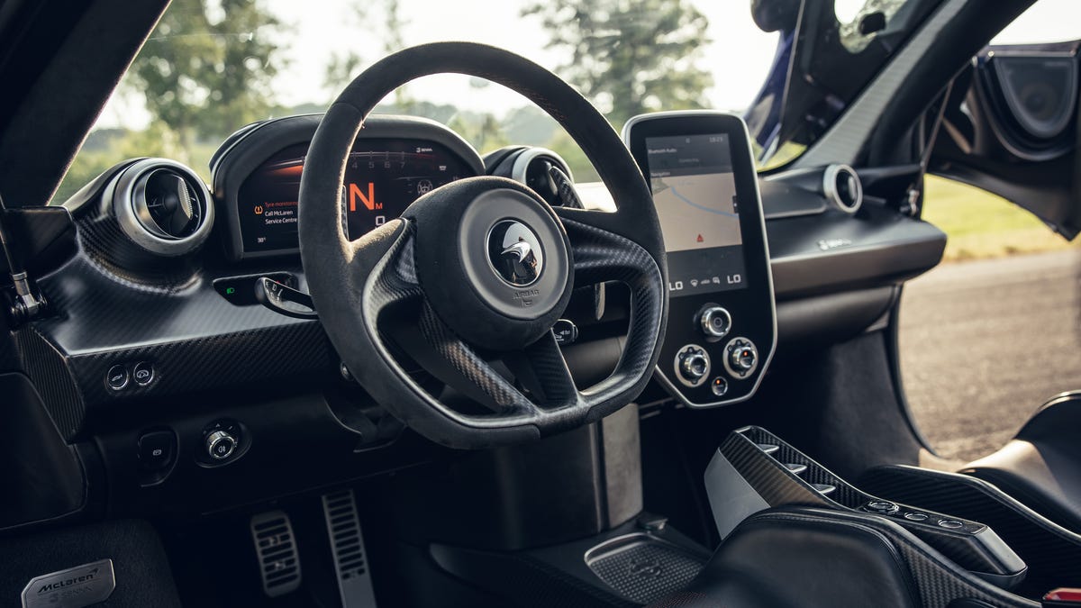 McLaren Senna carbon fibre interior showing the stripped-back racing cockpit and central display